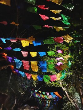 Colorful papel picados hanging over a street in Mexico