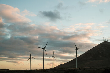 Windmills in the countryside at nightfall