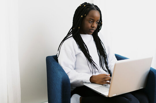 Young Black Woman Working In Home Office On Her Laptop