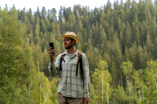 Man in the forest with phone
