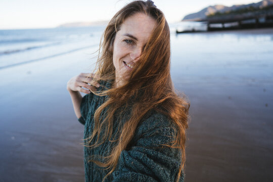 Young Woman Walking On The Beach