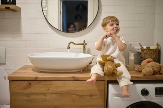 son brushing teeth
