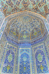 Colorful arched niches at courtyard of the Sher-Dor Madrasah