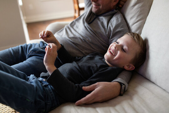 father and son watching tv