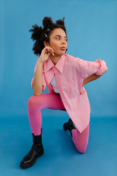 Stylish black woman in pink Y2K apparel