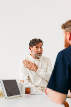 Doctor Examining Young Man 