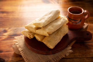 Tamales. Prehispanic dish typical of Mexico and some Latin American countries. Corn dough wrapped in corn leaves. The tamales are steamed.