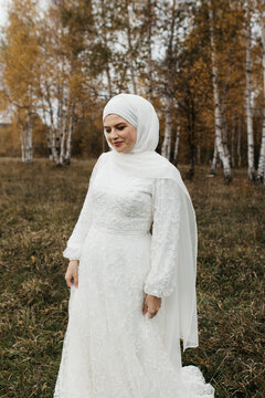 Woman with headscarf and floral patterned dress