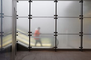 escalator behind opaque glass