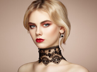 Portrait of beautiful swoman with elegant hairstyle.  Perfect makeup. Blonde girl. Fashion photo. Jewelry and lace