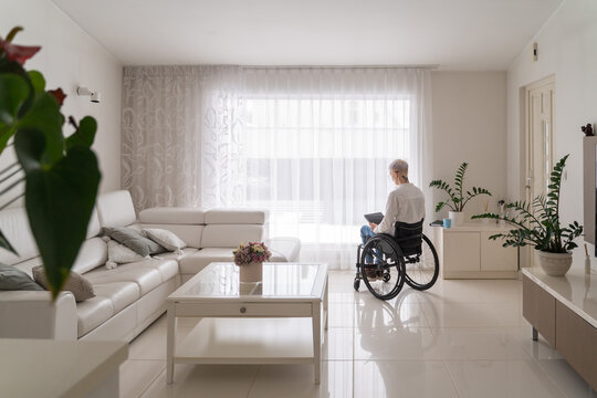 Woman In Wheelchair At Home