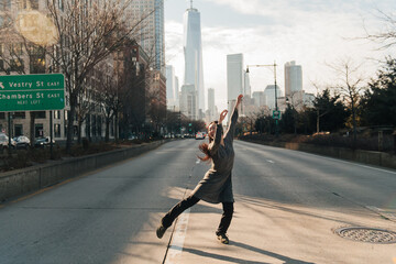 young female dancing on a crosswalk in NYC