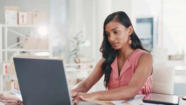 Focused woman open laptop, typing for business startup, office administration or logistics management and planning goals. Fashion designer or indian person working on computer for fast digital stock