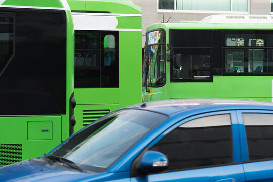 Parked green buses