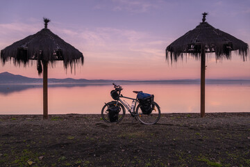Beautiful scene of travel bike on sunset