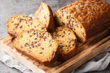 Fresh Homemade Chocolate Chip Pumpkin Bread ready to eat closeup on the wooden board on the table. Horizontal