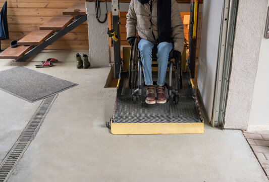 Person With Disability Using Wheelchair Lift