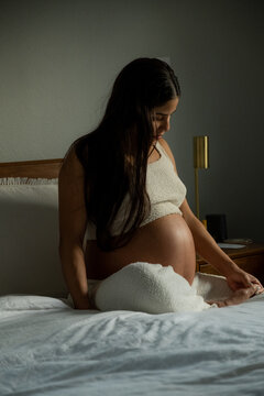 Pregnant Woman resting in bed