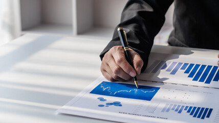Businessman, financial auditor and secretary doing balance calculation report The Revenue...