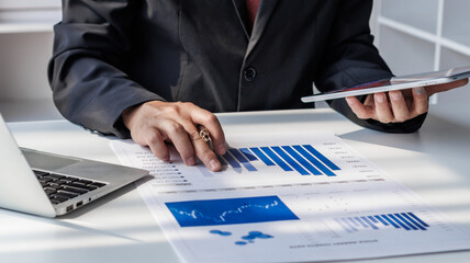 Businessman, financial auditor and secretary doing balance calculation report The Revenue...
