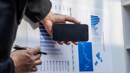 Businessman, financial auditor and secretary doing balance calculation report The Revenue...