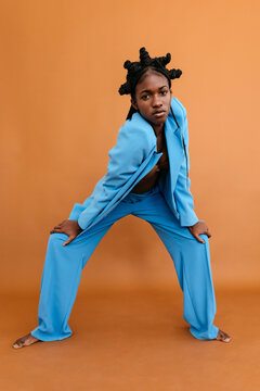 Black dancer in suit looking at camera