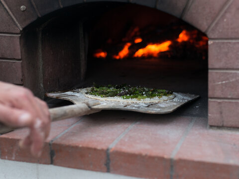 Pizza on a stone oven