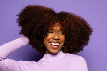 Cheerful black woman with curly hair