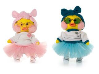 Two Handmade toy yellow duck LaLafanfan in blue and pink. Front view. Full depth of field. With clipping path