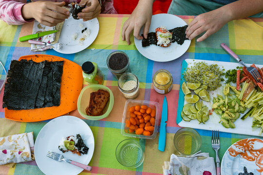 Sushi roll making outdoors potluck
