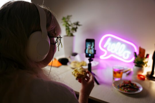 Teen girl using smartphone at night