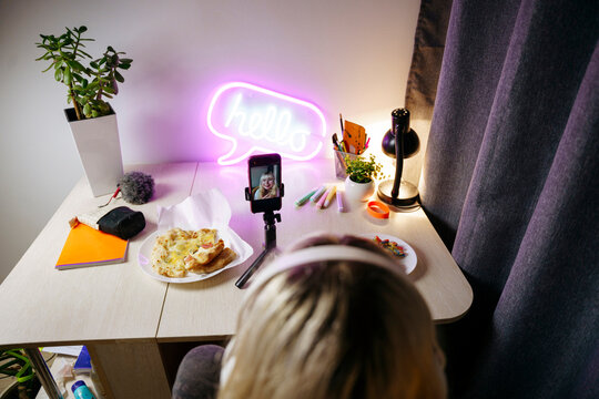 Teen girl using smartphone at night