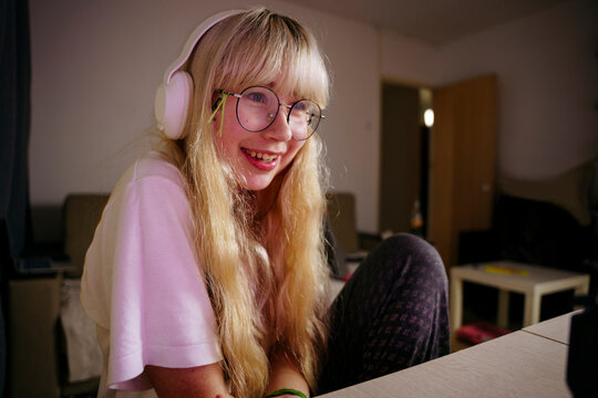 Teen girl using smartphone at night
