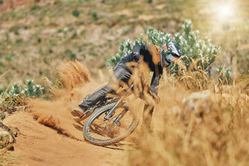 Extreme sports, man and cycling on bicycle in the countryside for fitness, stunt and freedom. Nature, biking and sporty male cyclist training, practice and speed, action and free on Mexico dirt road