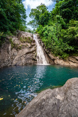 Fototapeta na wymiar Beautiful Maribiina waterfalls at Bato, Catanduanes, Philippines