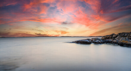 Coastal scene with sunset clouds, Sweden.