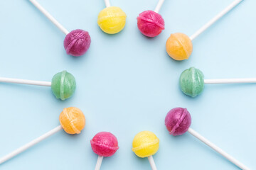 Sweet lollipops on blue background