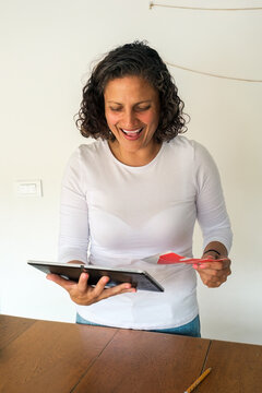 Designer viewing her creations on a tablet