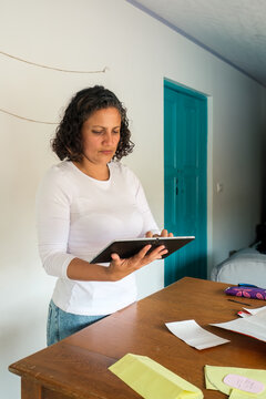Latina designer using a tablet