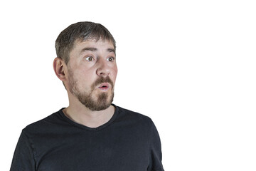 Portrait of an attractive bearded man of European appearance, with a slight gray hair, on an isolated white background. Surprised facial expression. Expression of emotions of a man.