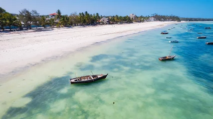 Cercles muraux Plage de Nungwi, Tanzanie The white sandy beaches of Zanzibar are the ideal spot for spending lazy Zanzibar beach summers.