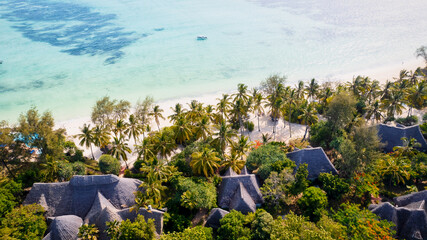 Experience the tranquility and beauty of Zanzibar Beach, where crystal-clear waters meet white...