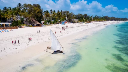 Photo sur Plexiglas Plage de Nungwi, Tanzanie The white sandy beaches of Zanzibar are the ideal spot for spending lazy Zanzibar beach summers.