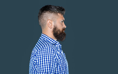 bearded serious man profile wear checkered shirt on grey background