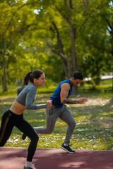 Young couple jogging together in nature