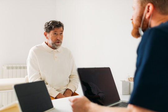 Doctor Examining Senior Man 