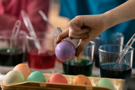 Children Coloring Easter Eggs At Home