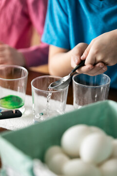 Children Adding Vinegar To Easter Egg Dye