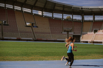 Female sportspeople jogging together