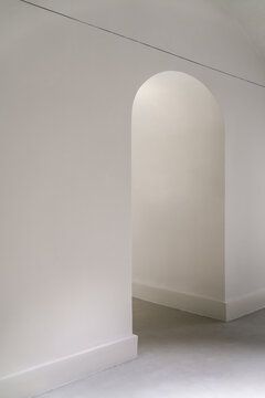 White space with archway and textured floor